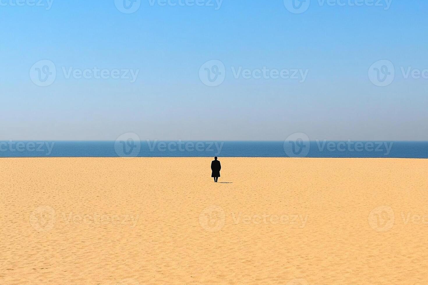 A lone person walking in the desert photo