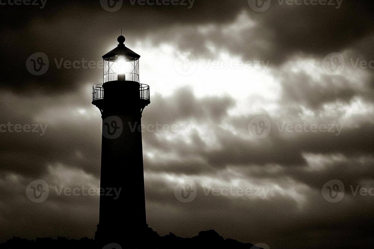 A black and white photo of a lighthouse under a cloudy sky