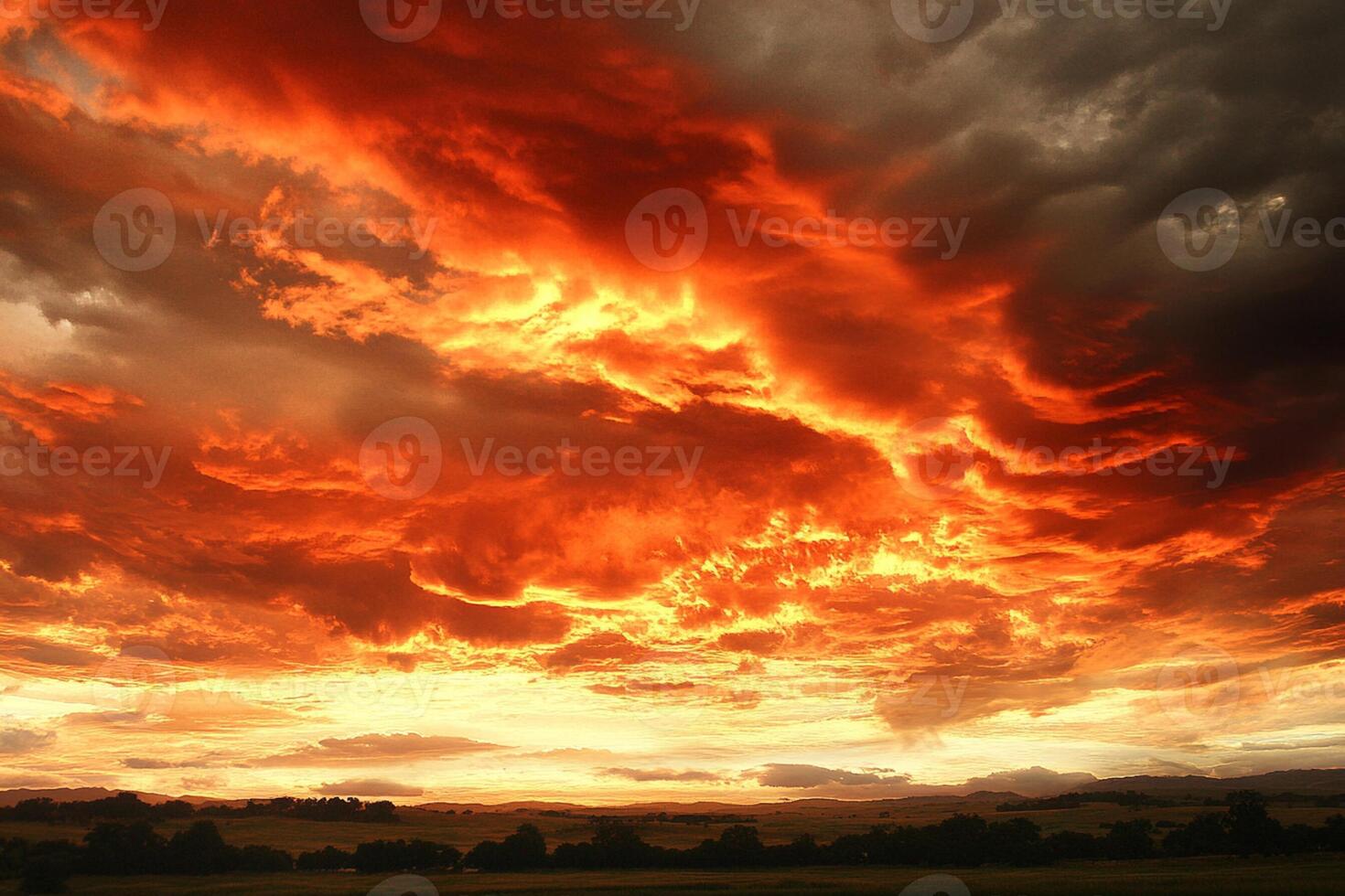 A beautiful sunset over a field with clouds photo
