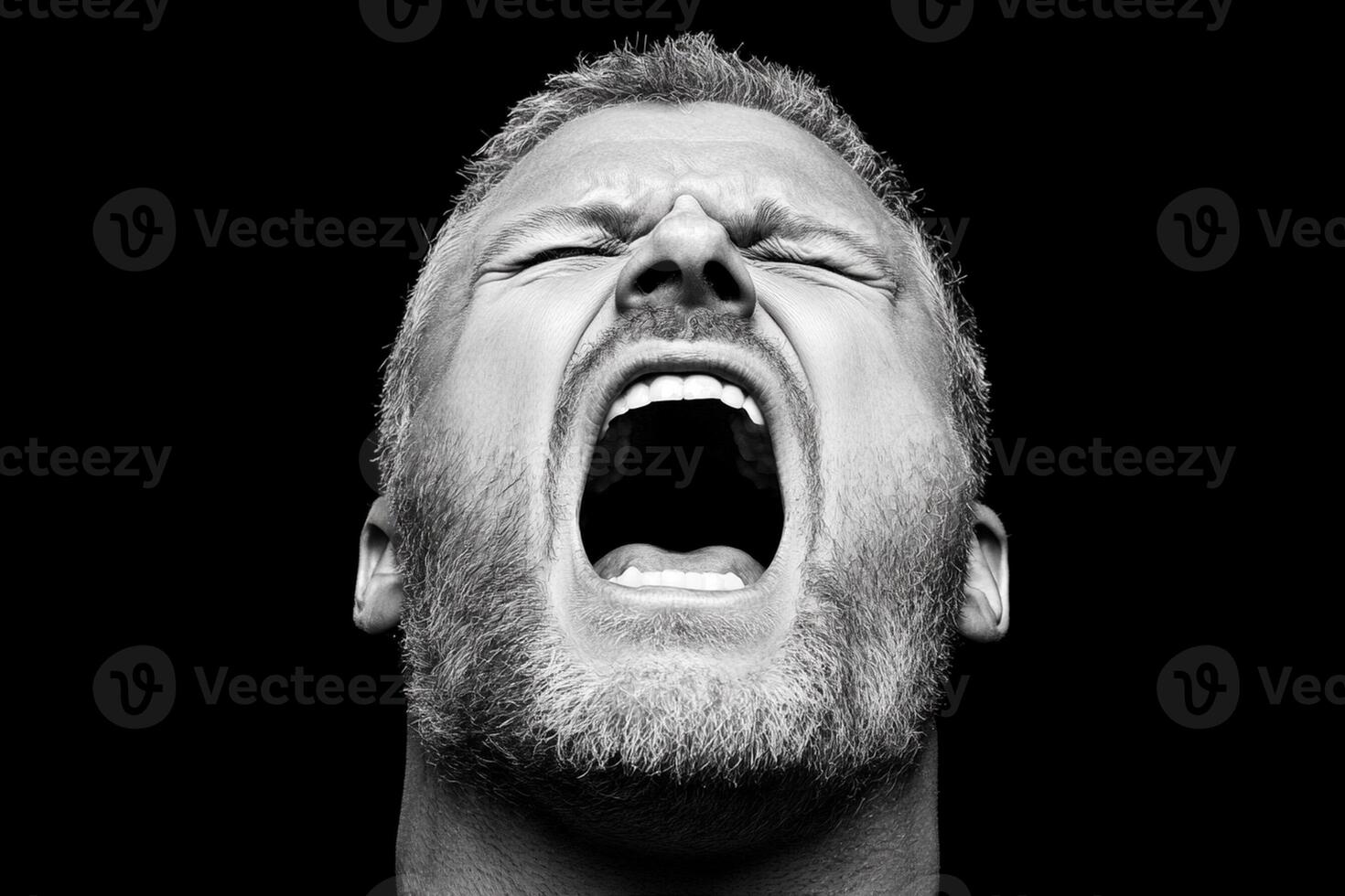 A man with his mouth open and his eyes wide photo