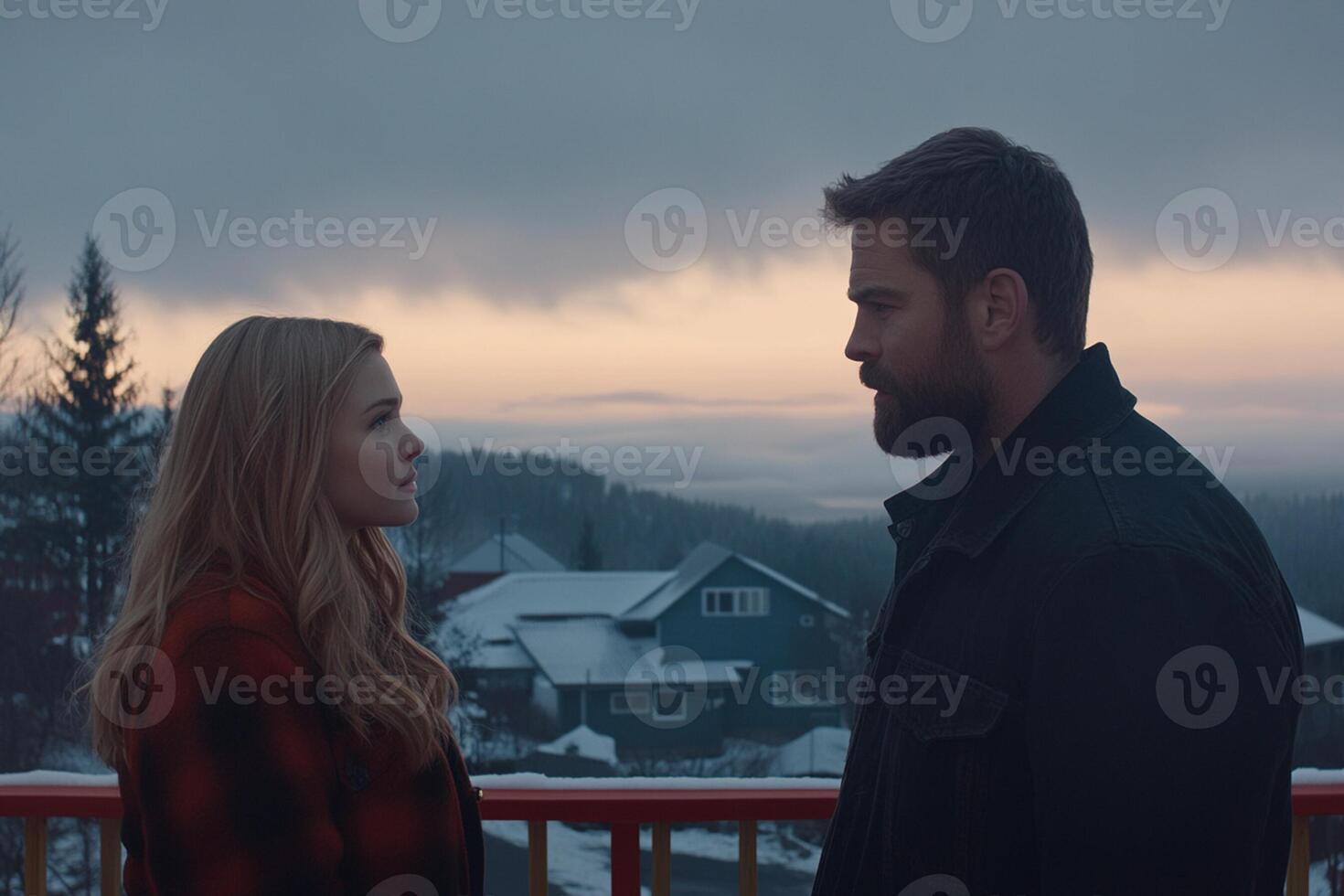 A man and woman standing on a balcony looking at each other photo
