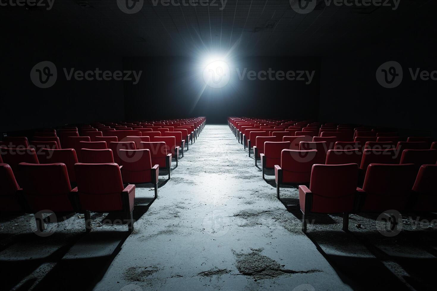 Empty cinema seats with a light shining on them photo