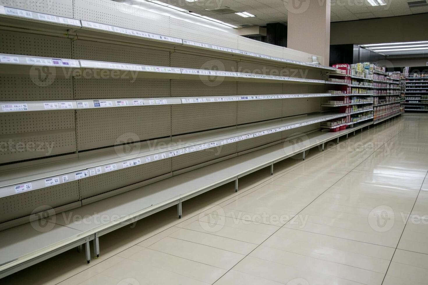 Empty shelves in a supermarket aisle photo