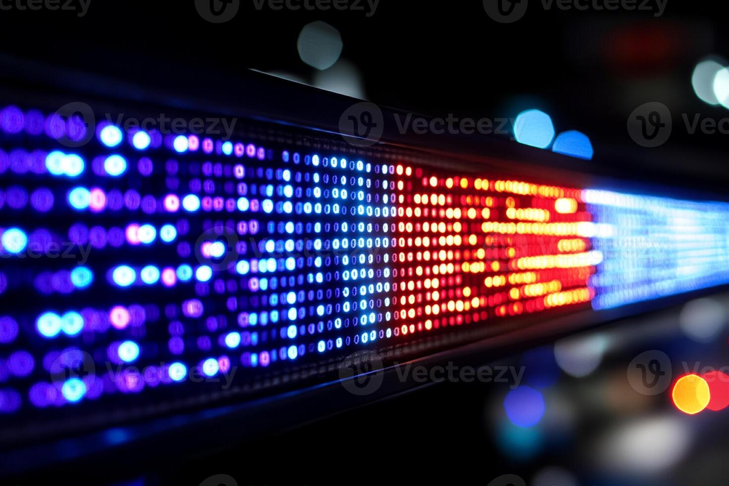 A close up of a colorful led strip on a wall photo