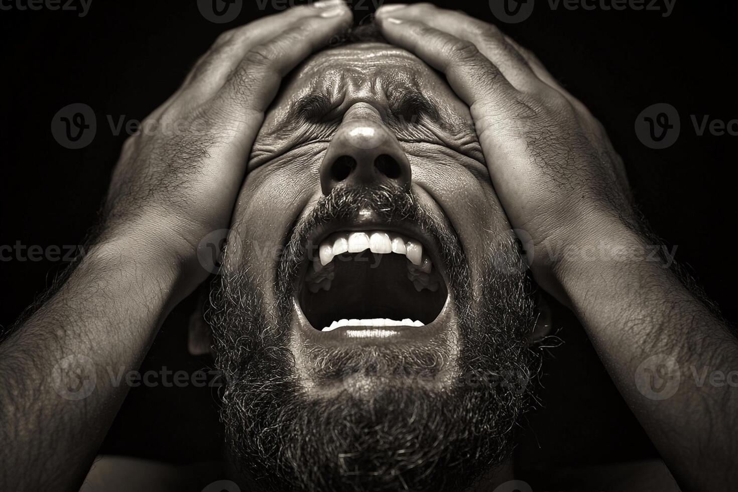 A man with his hands on his head photo