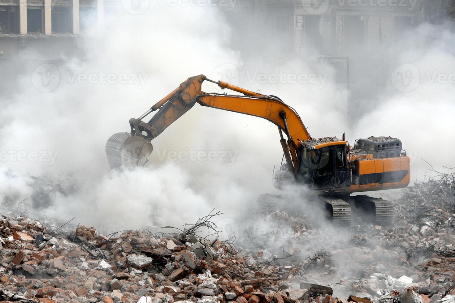 A large excavator is working on a pile of rubble photo