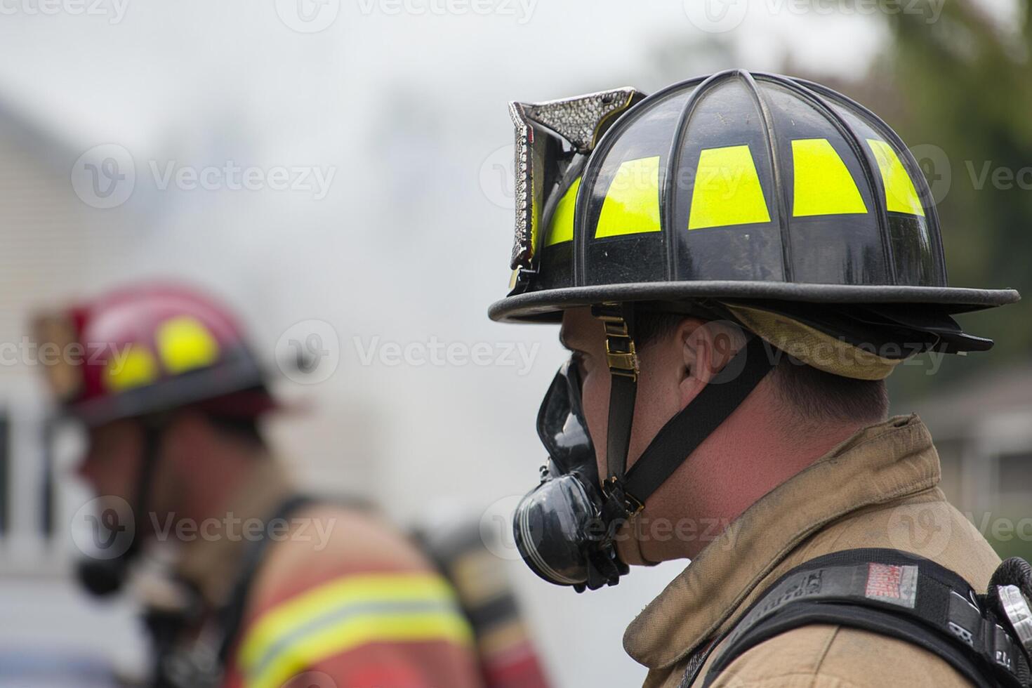A firefighter wearing a helmet and a gas mask photo