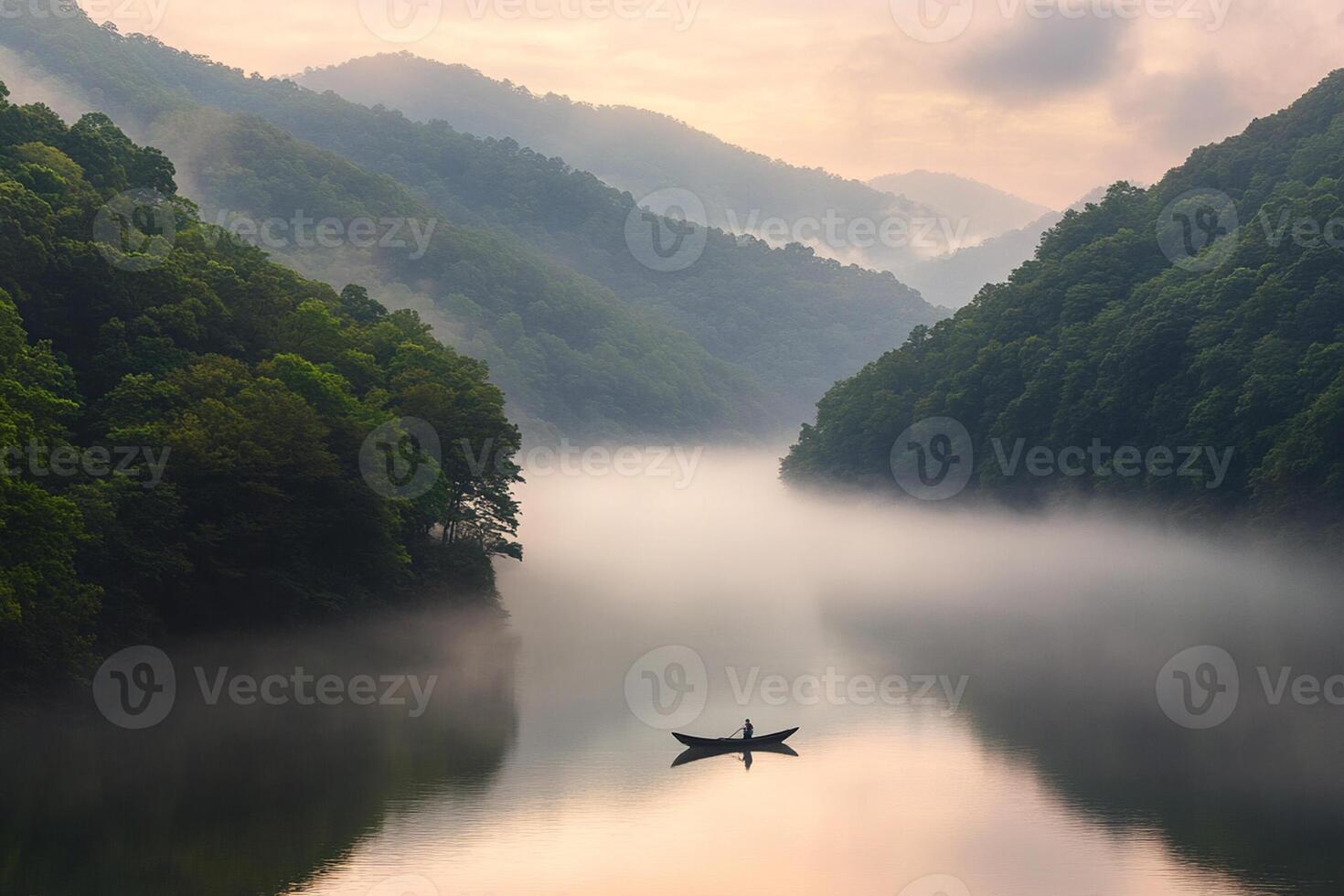 A man in a boat on a river surrounded by trees photo