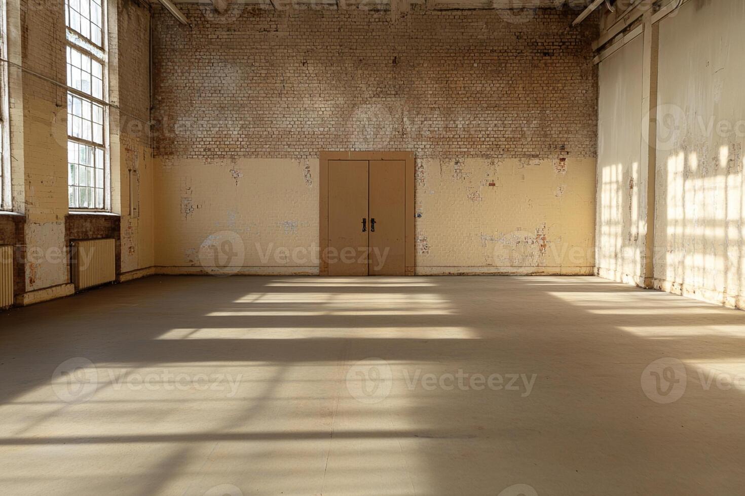 A large empty room with a door and a window photo