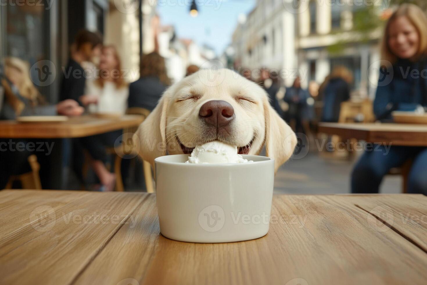 A dog sitting in front of a cup of ice cream photo