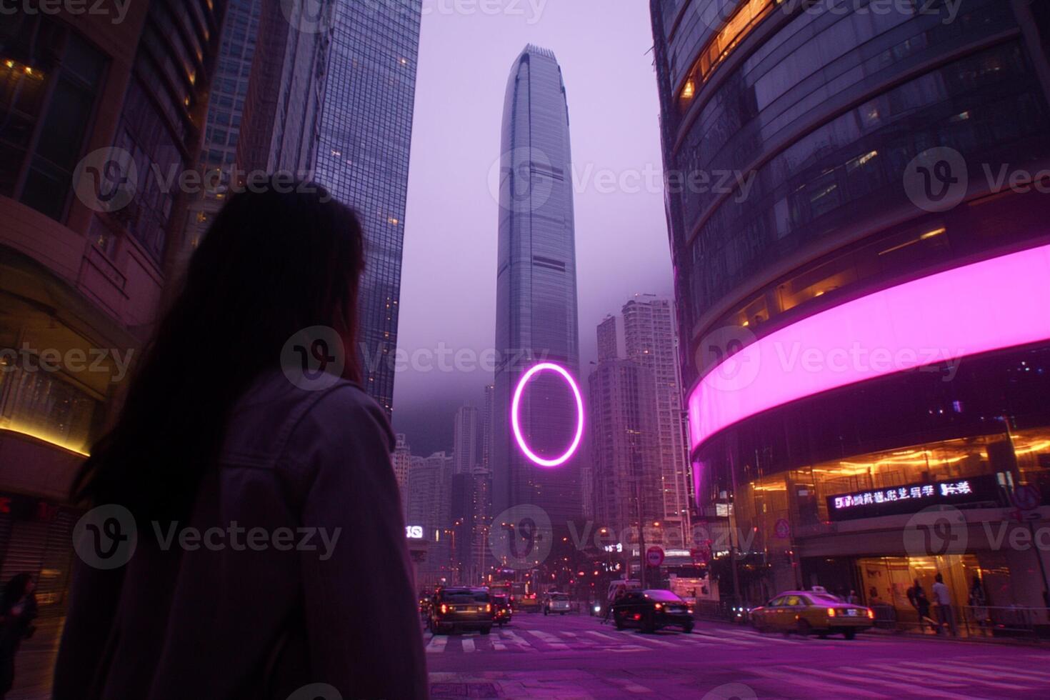 A woman standing in front of a purple lighted circle photo