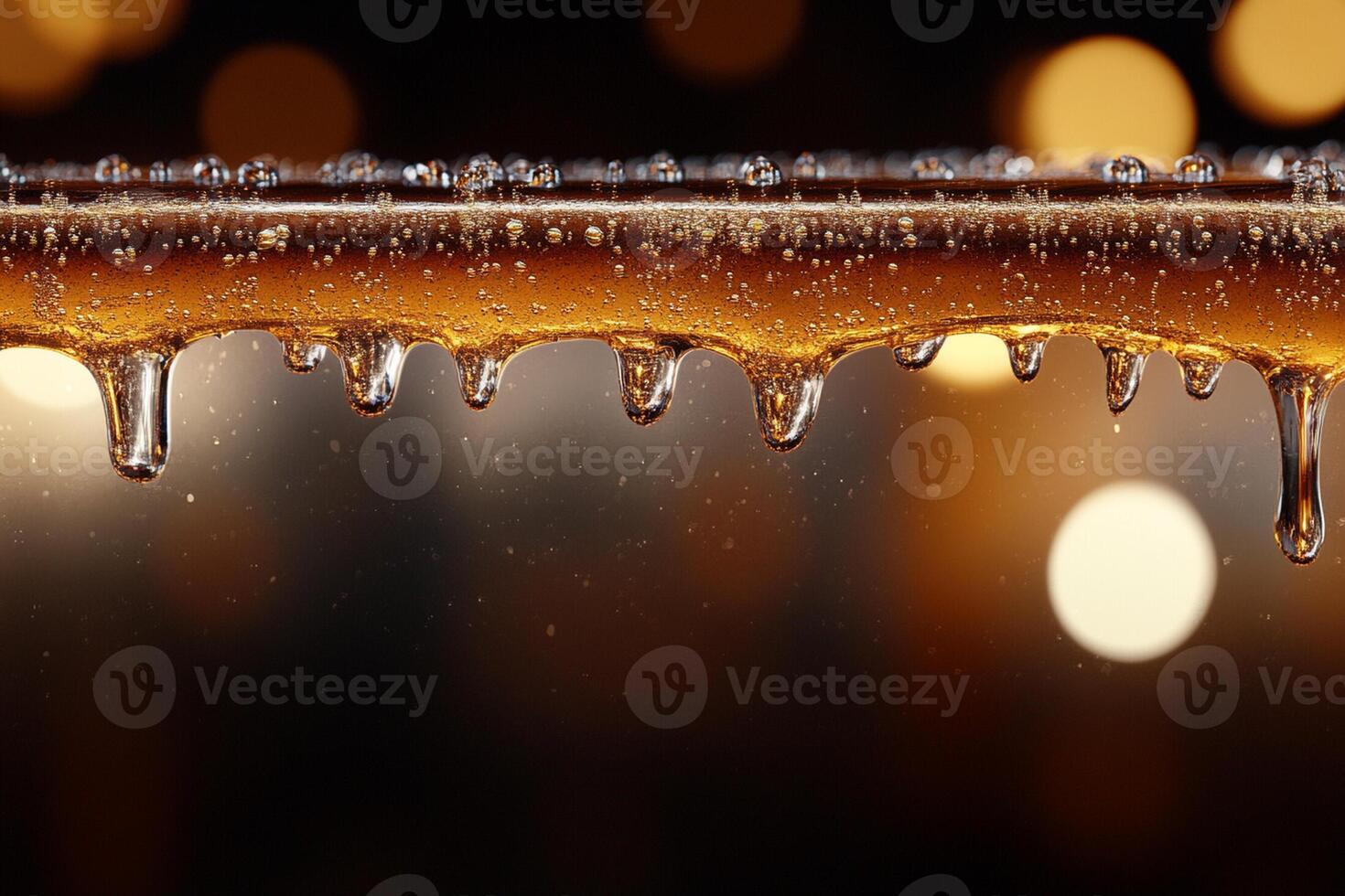 A close up of a glass of beer with ice photo