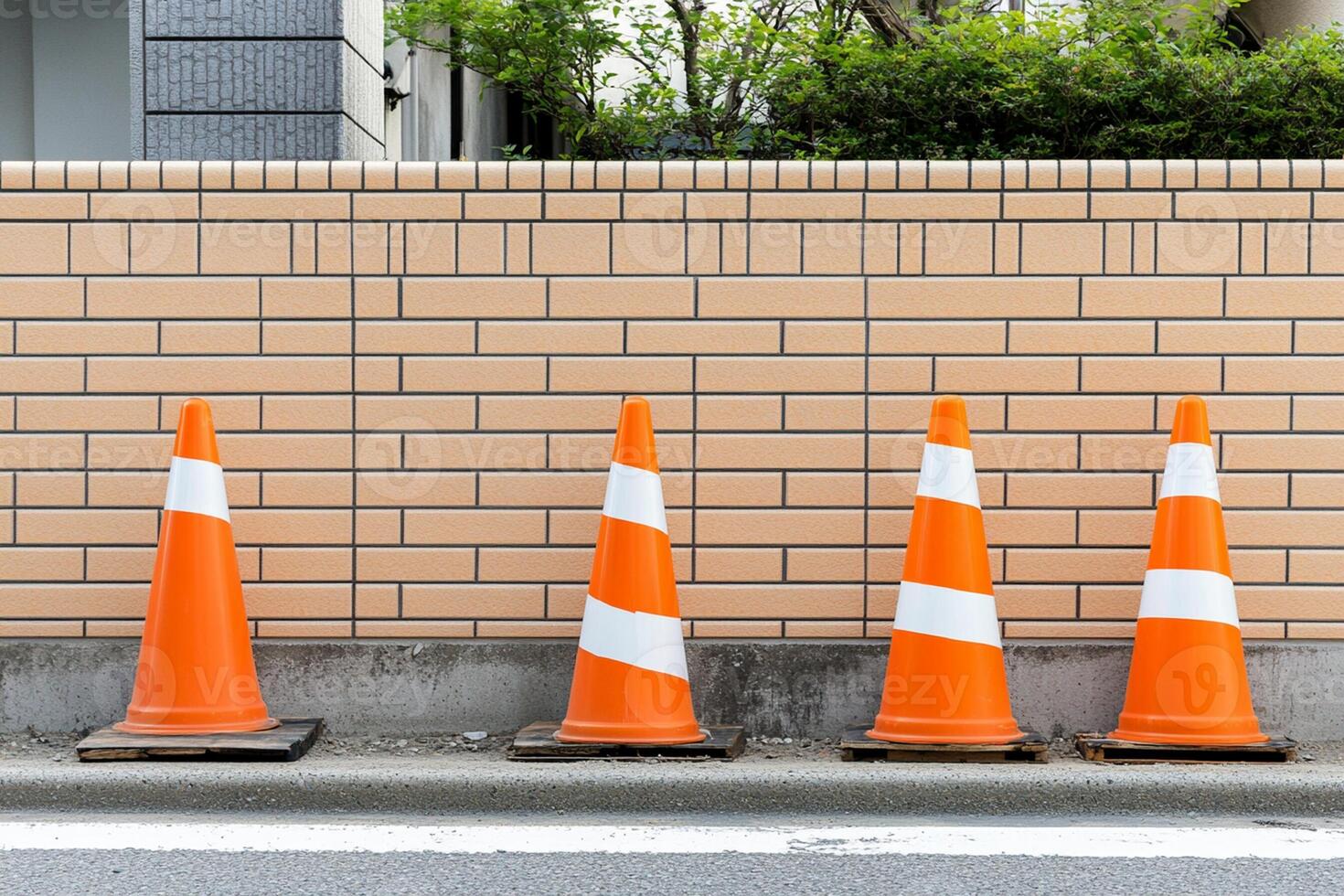 A row of orange and white traffic cones photo