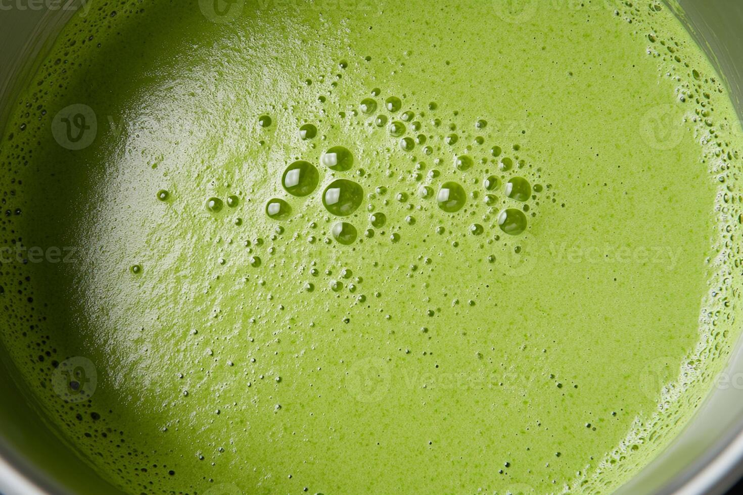 A close up of a green liquid in a pot photo