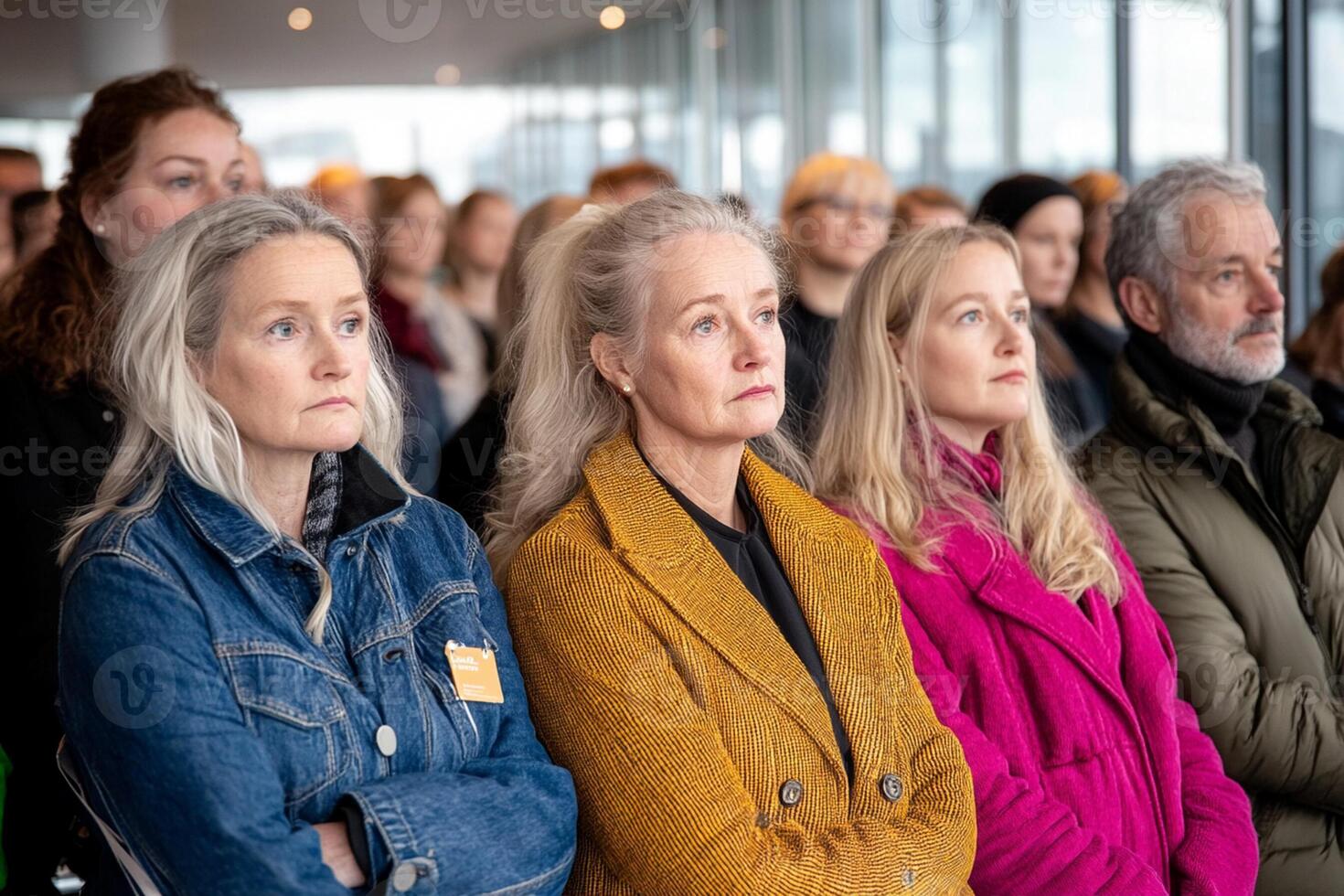 A group of people sitting in a line photo