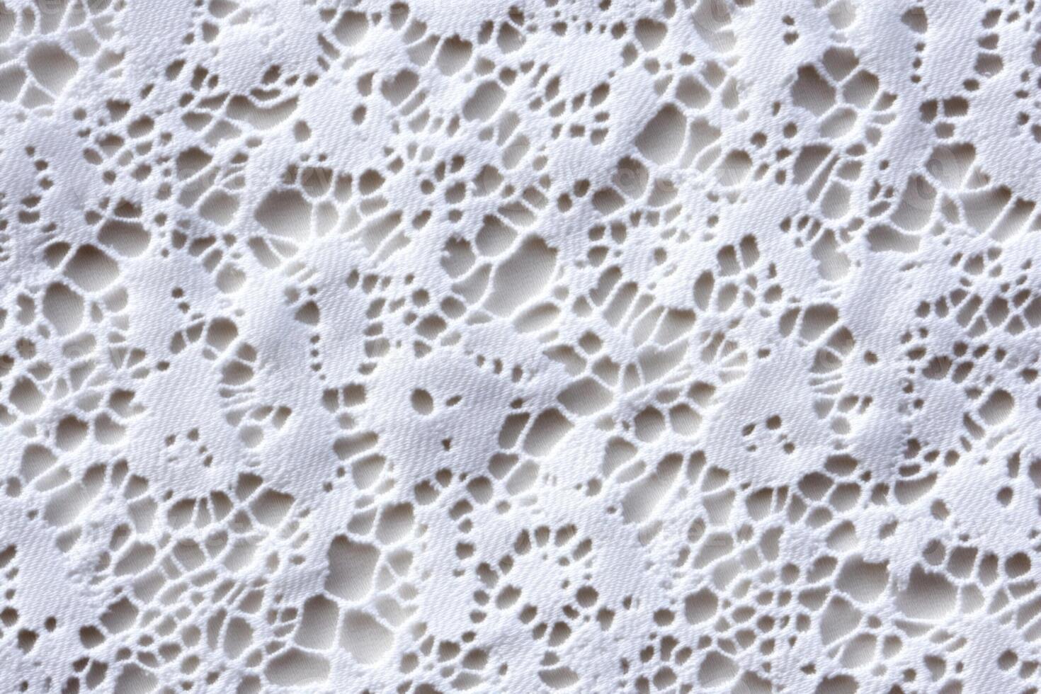 A close up of a white lace pattern photo