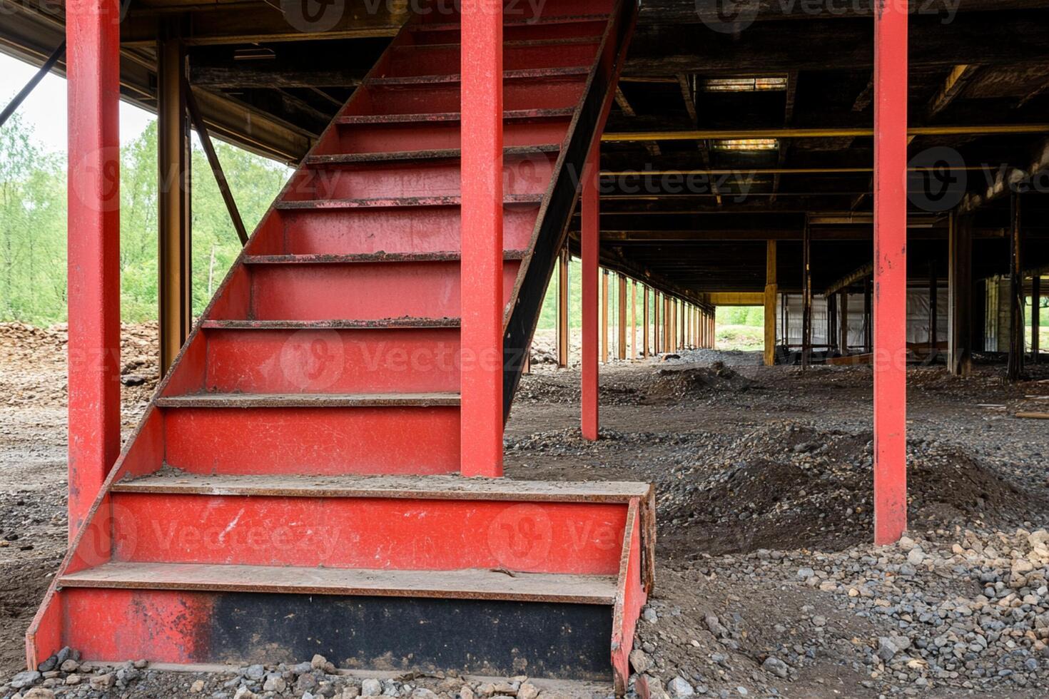 A red stairway in a building with a lot of dirt photo