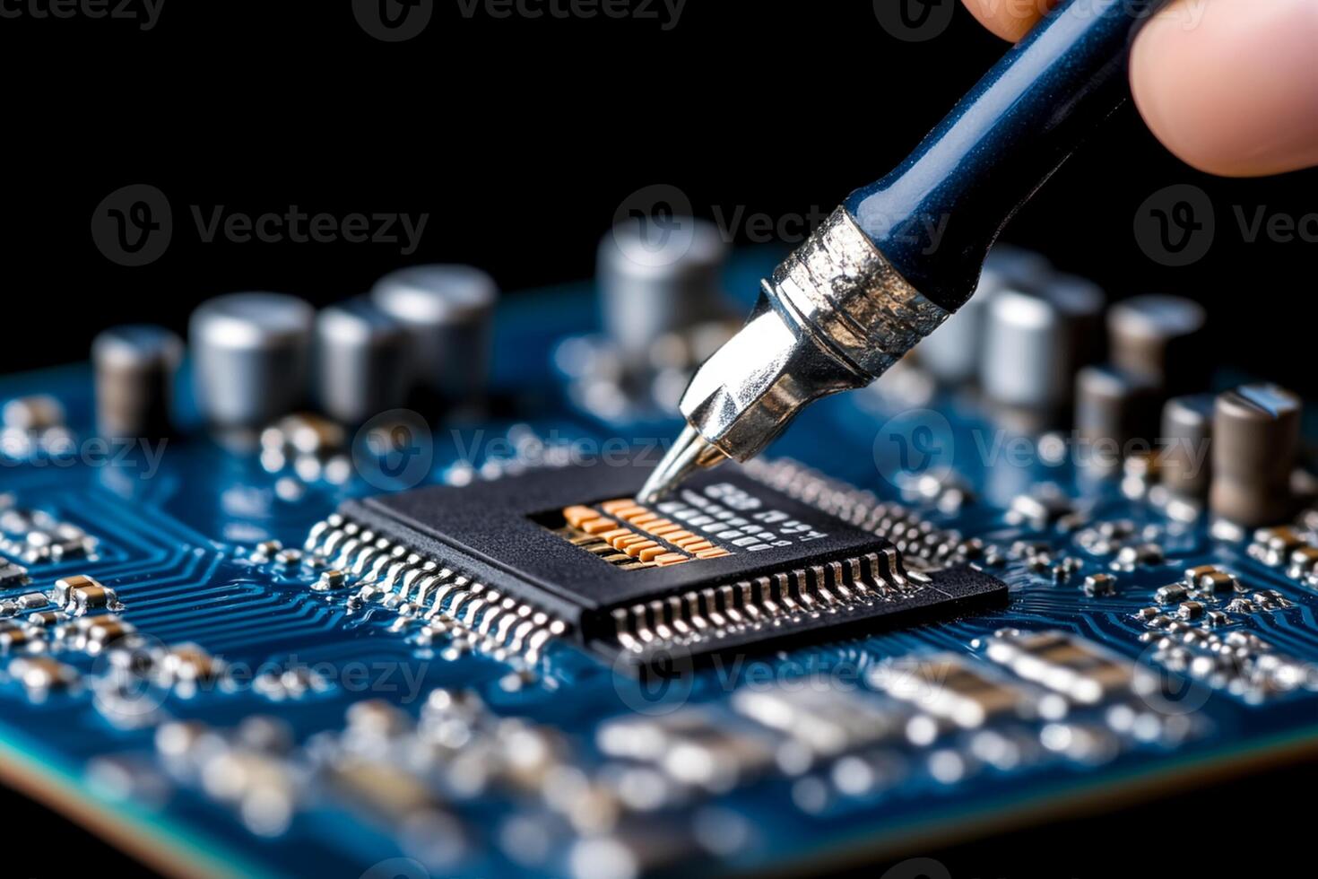A person is using a pen to write on a micro chip photo
