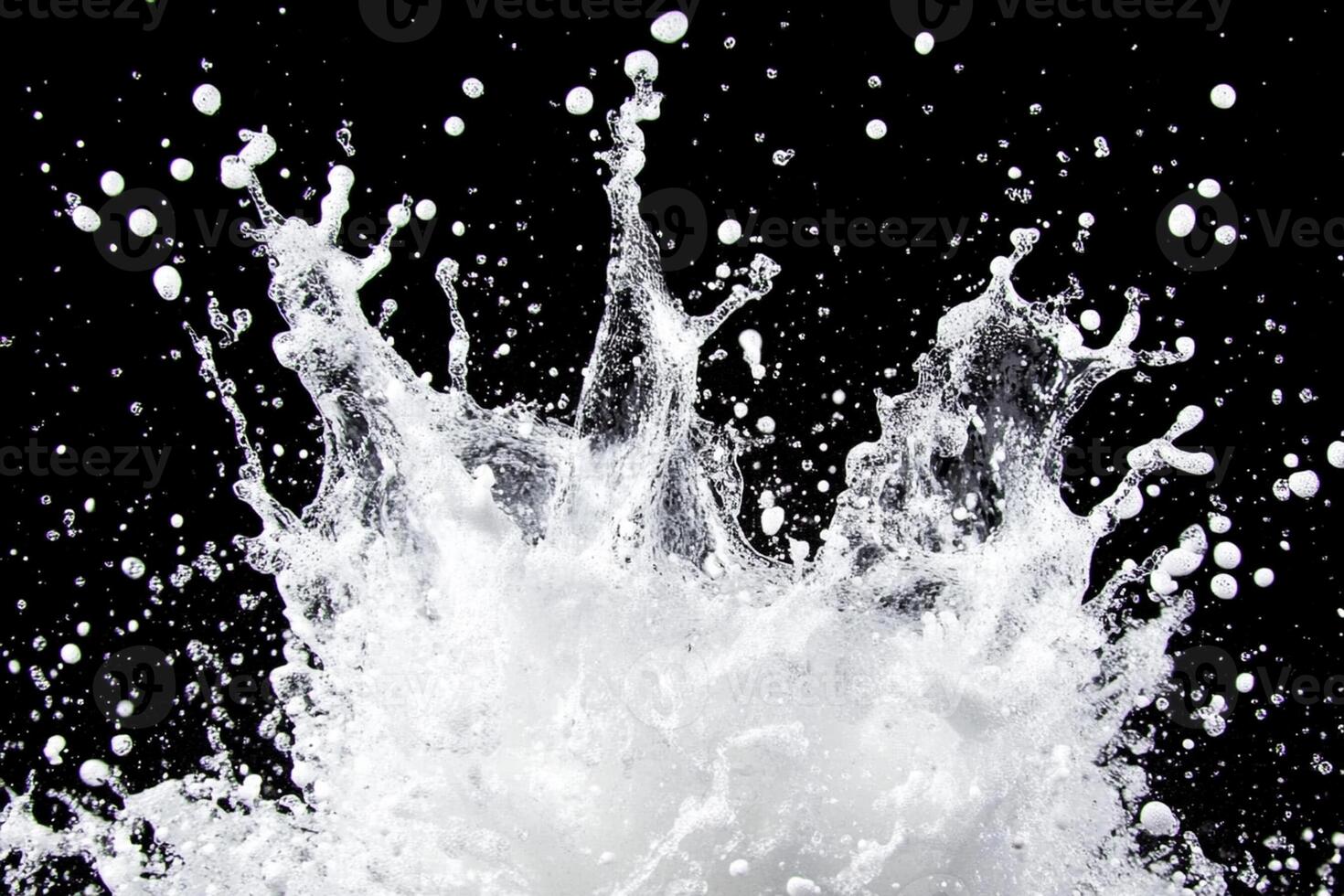 A splash of water is shown on a black background photo