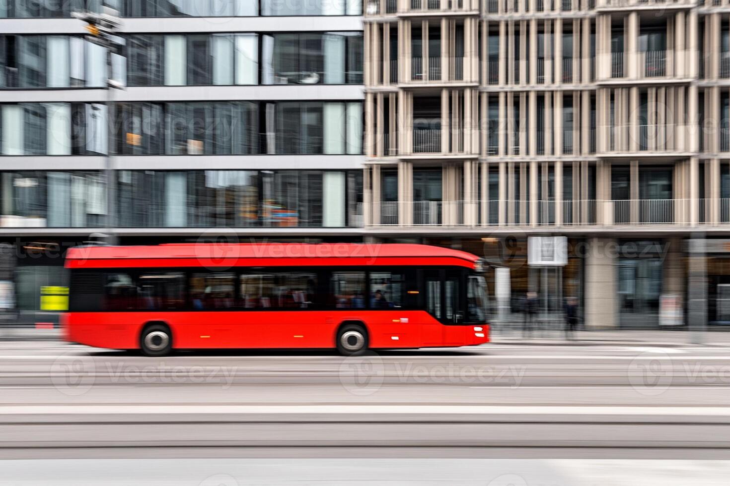 A red bus driving down a street photo