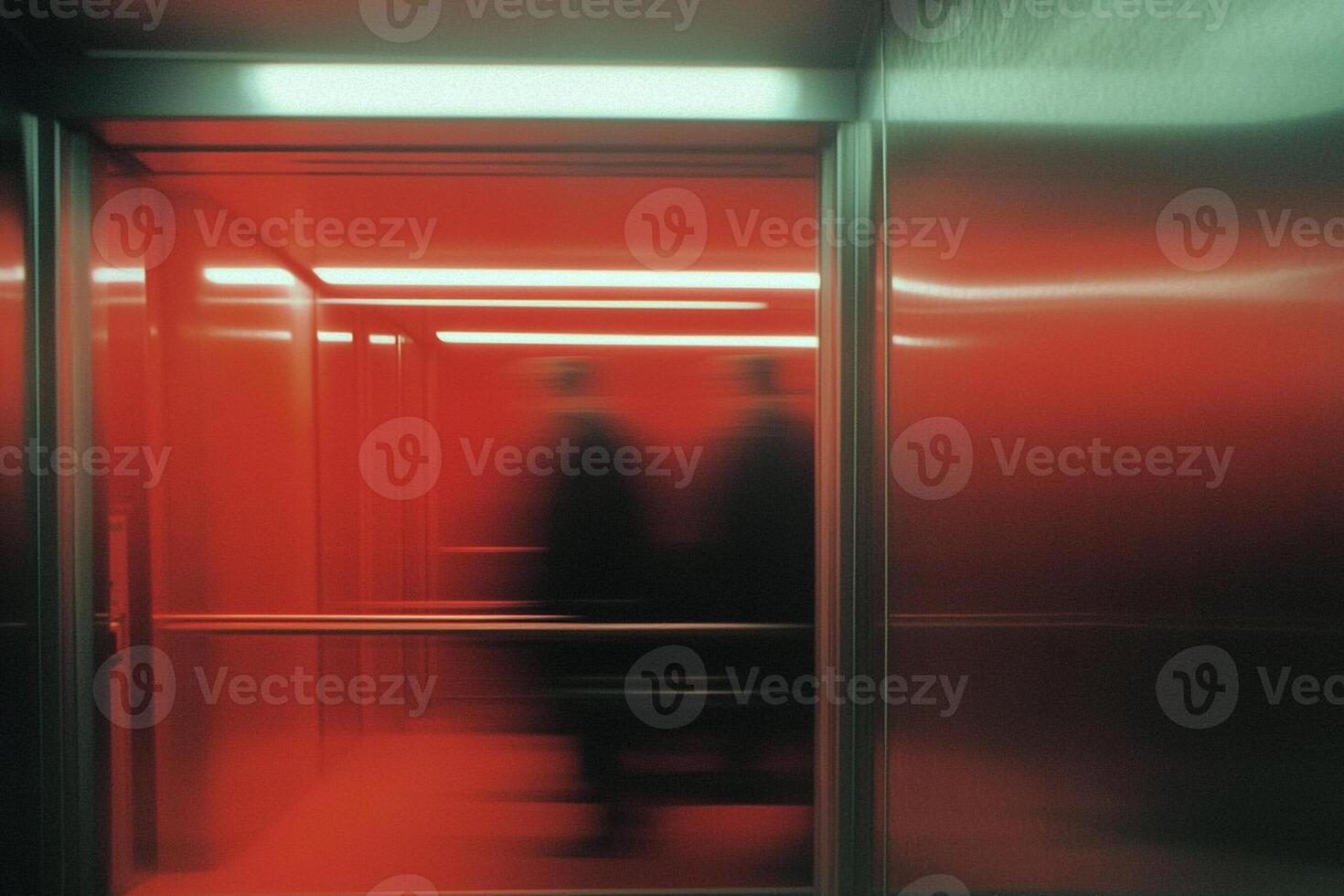 Two people are walking through an elevator door photo