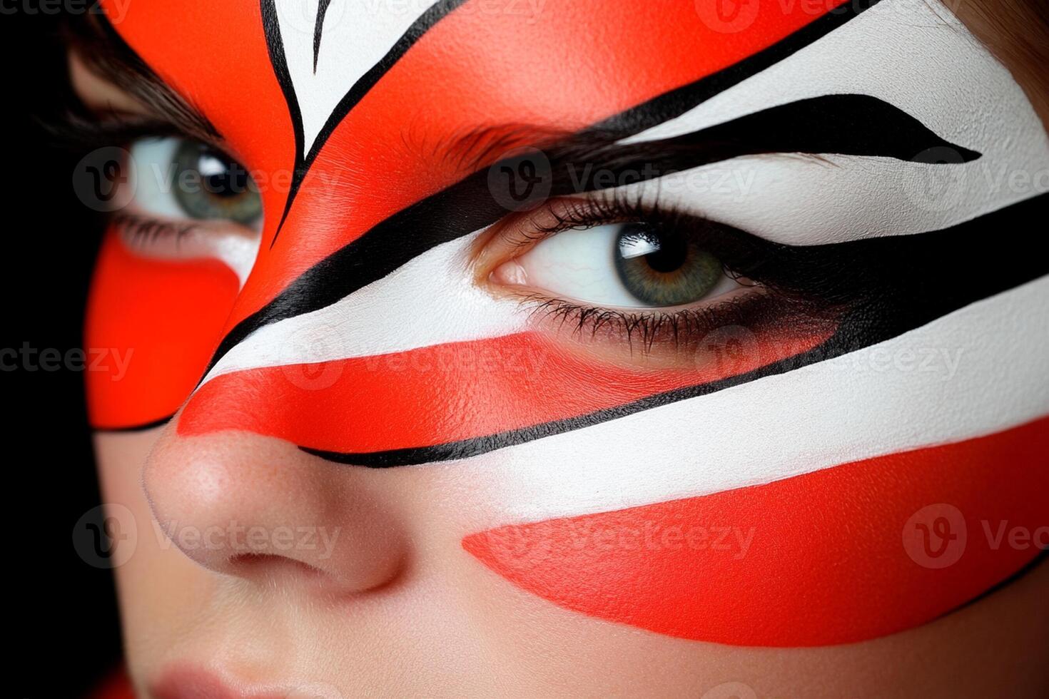 A woman with a painted face and a tiger's face photo