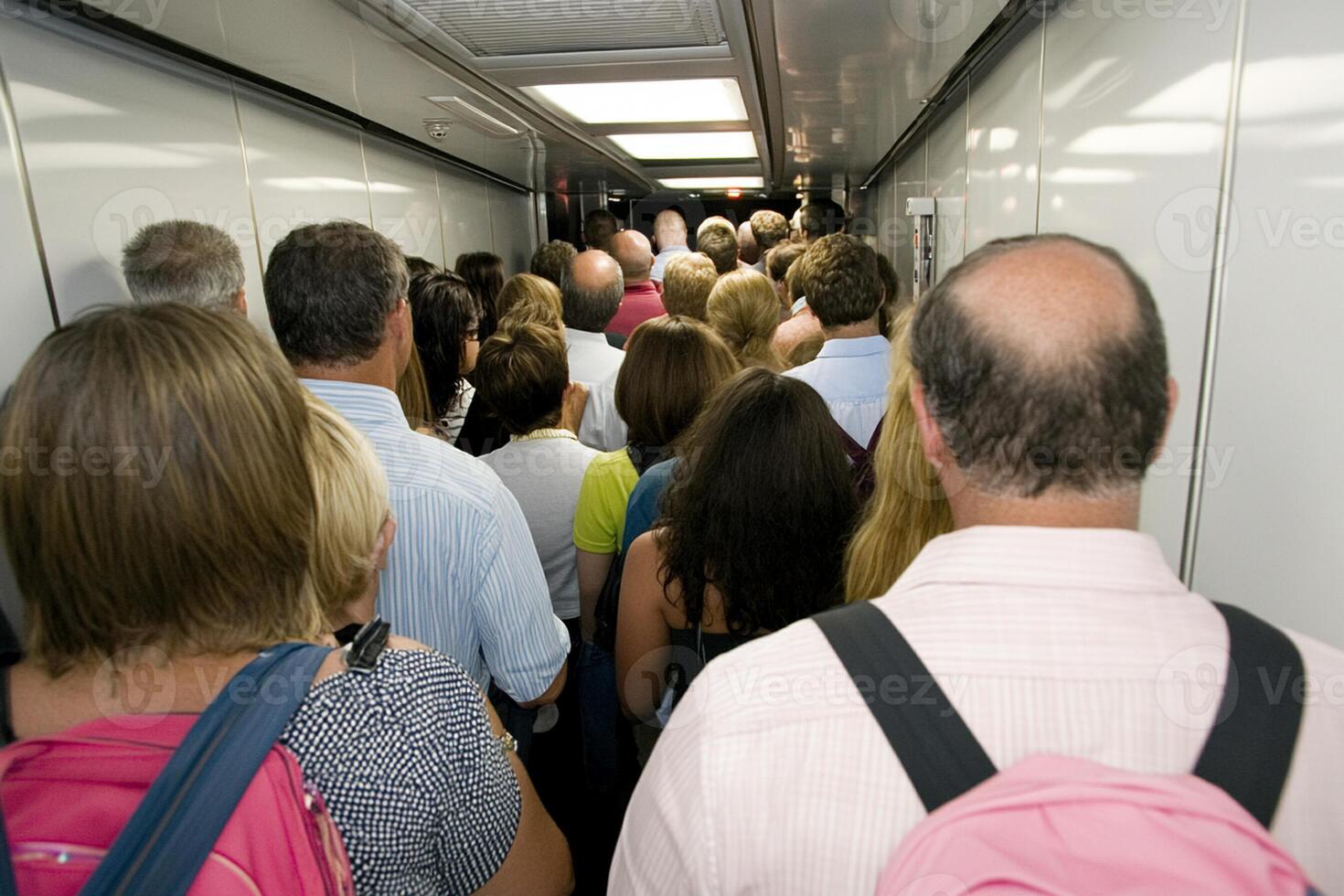 A crowd of people in a train photo