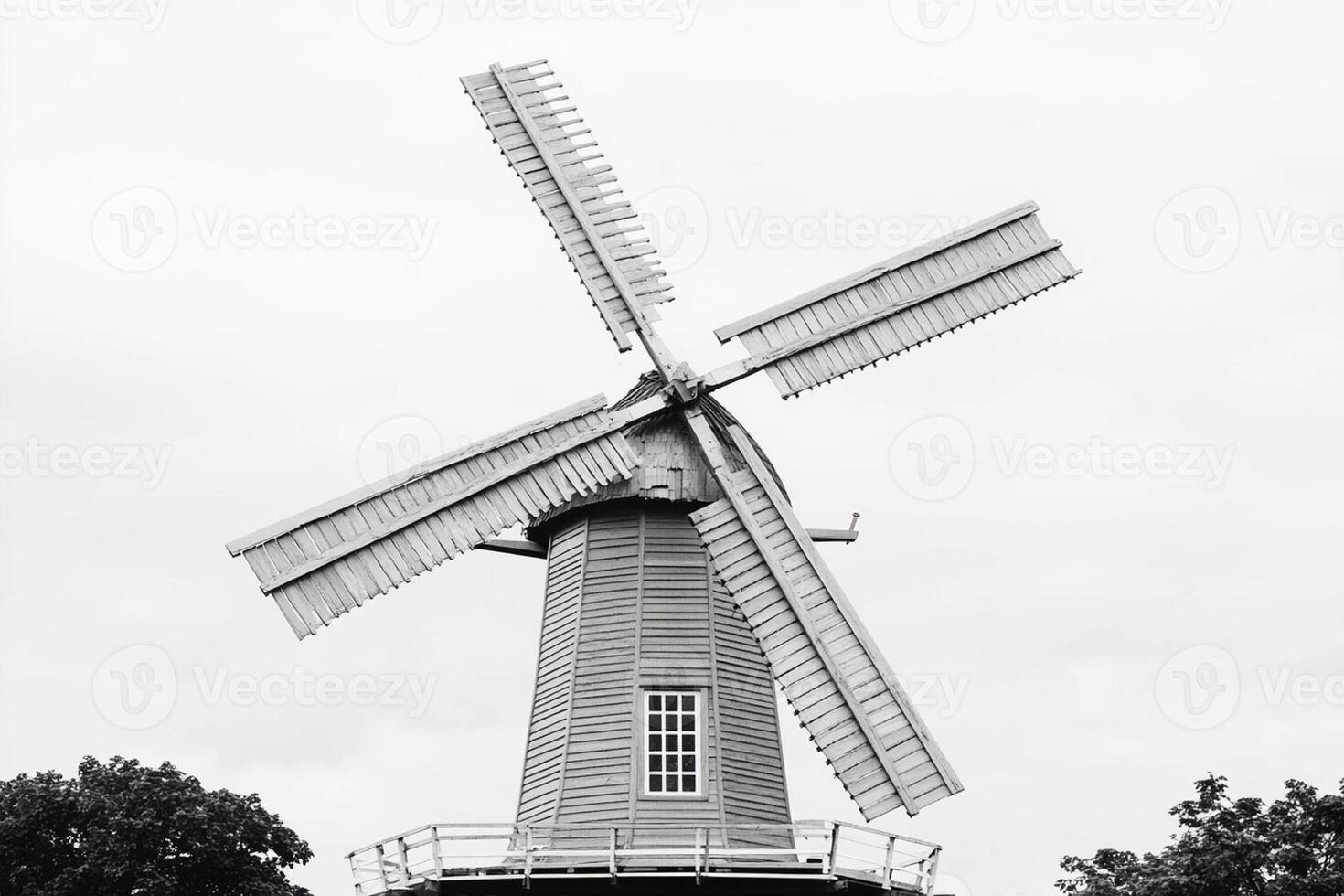 A black and white photo of a windmill