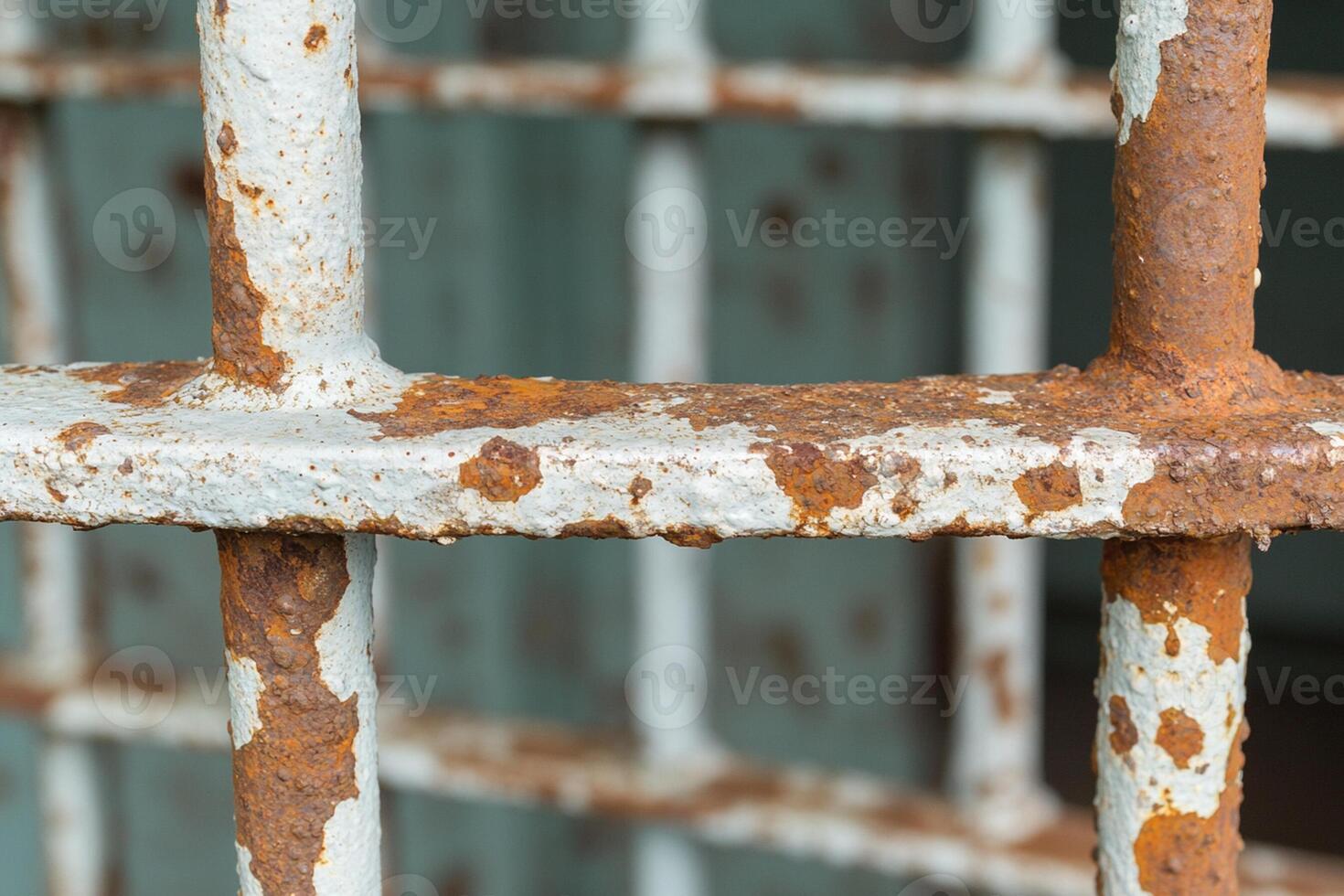 A rusty metal door with a rusty metal bar photo