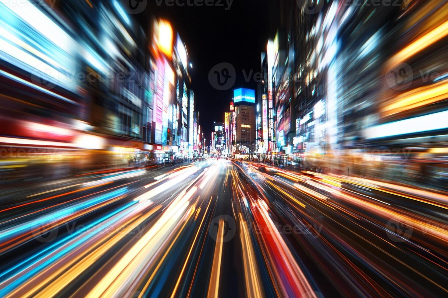 A blurry image of a busy city street at night photo
