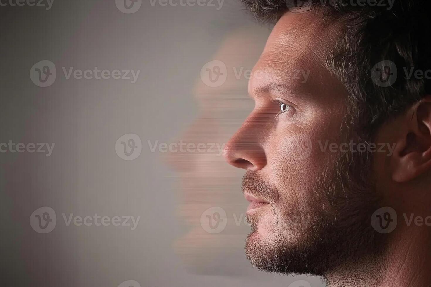 A man with a beard and a blurred face photo