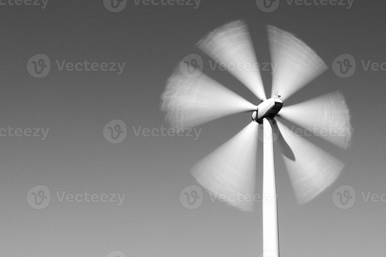 A black and white photo of a wind turbine