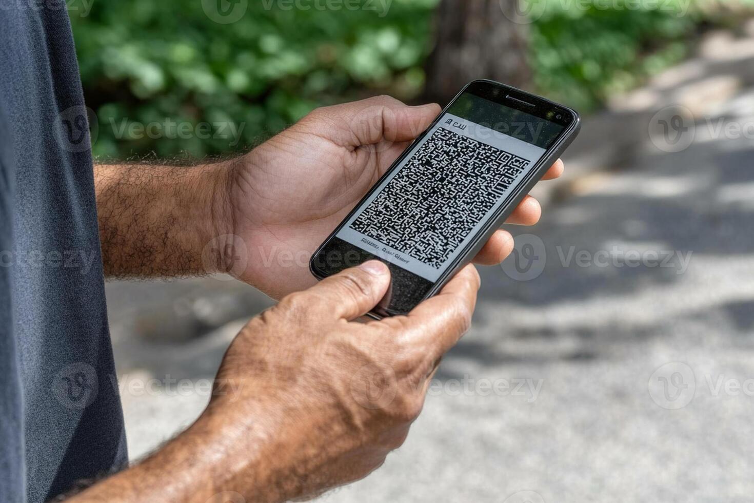 A man holding a smartphone with a qr code on it photo