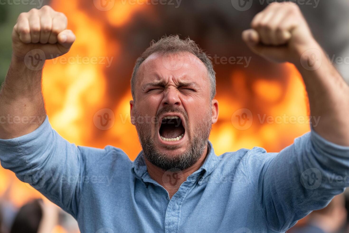 Man shouting in front of a burning building photo