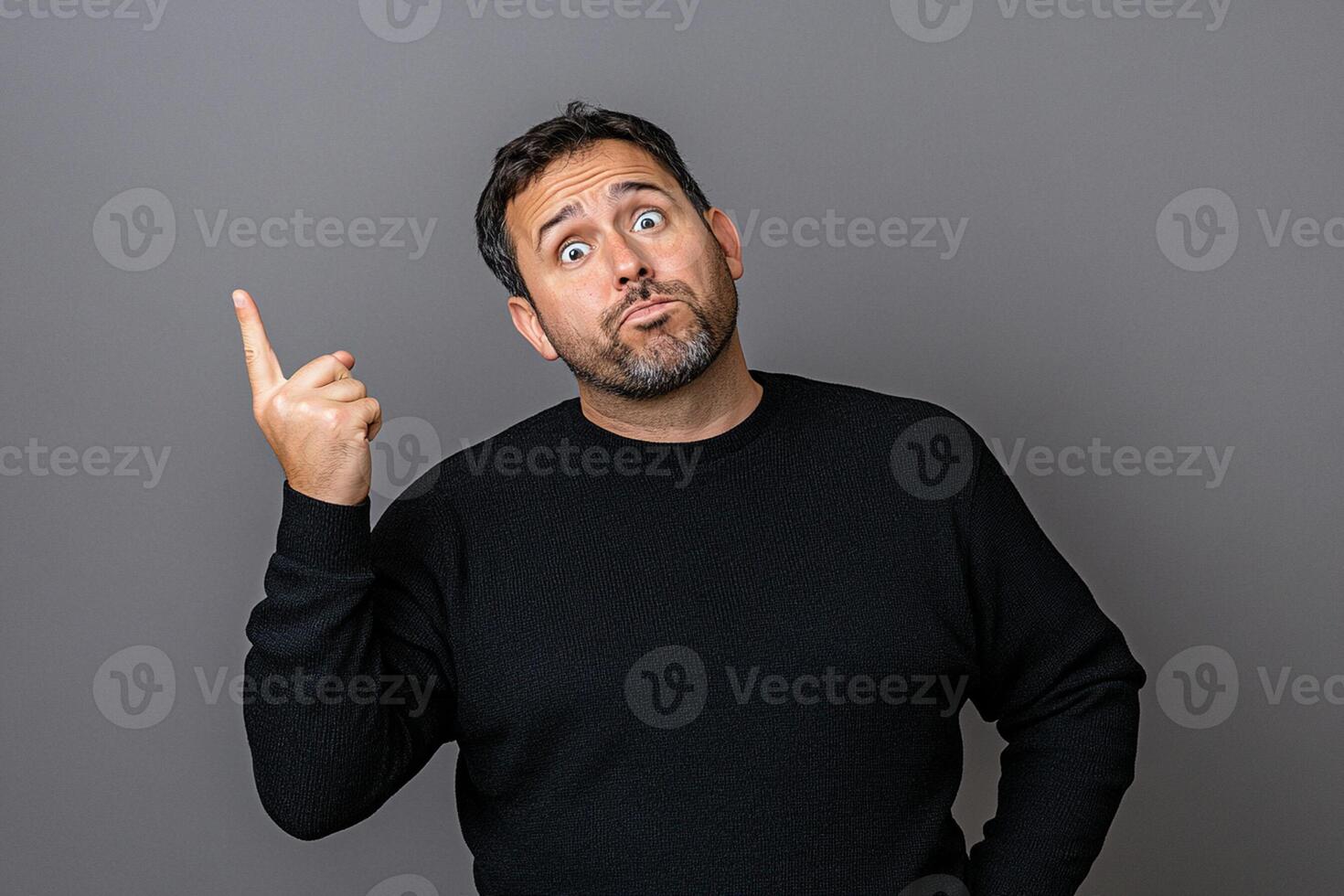 A man is pointing his finger up photo