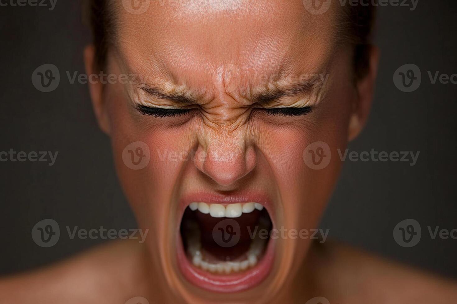 A woman with her mouth open and her eyes wide photo