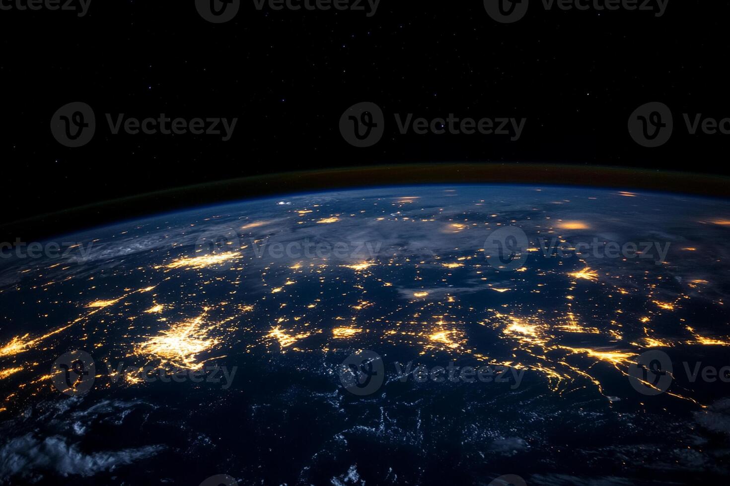 The earth at night with lights shining from space photo