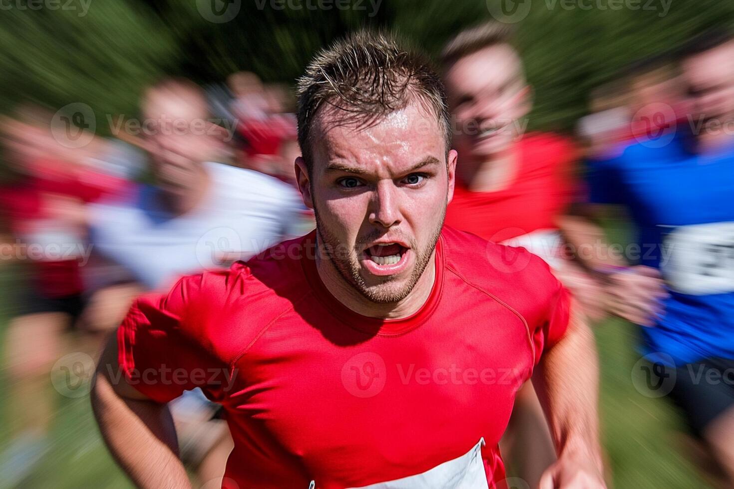 A man running in a race with other people photo