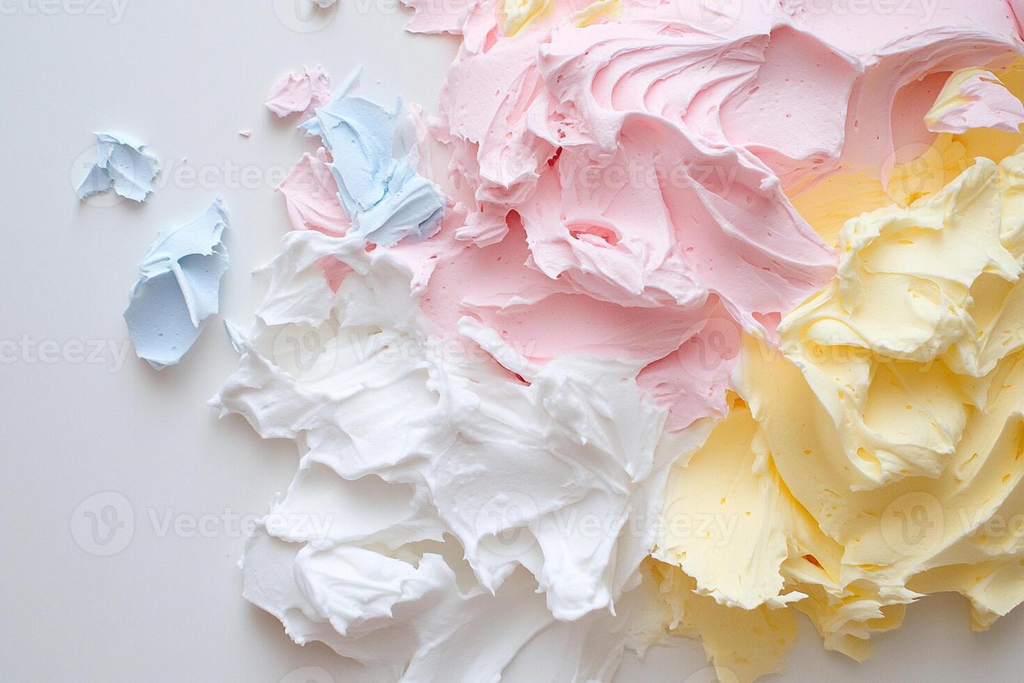 A pile of frosting on a white surface photo