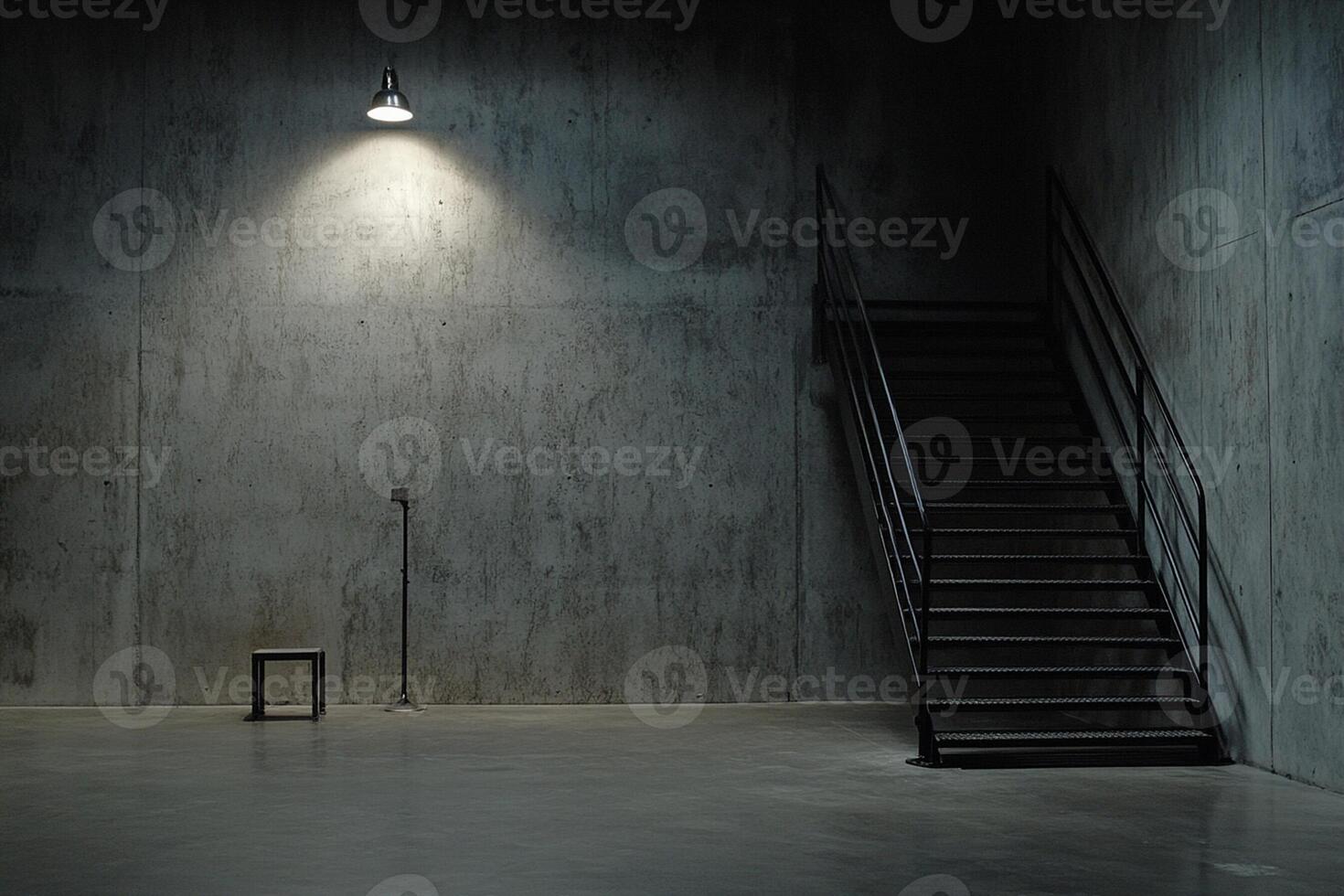An empty room with a stairway and a light photo