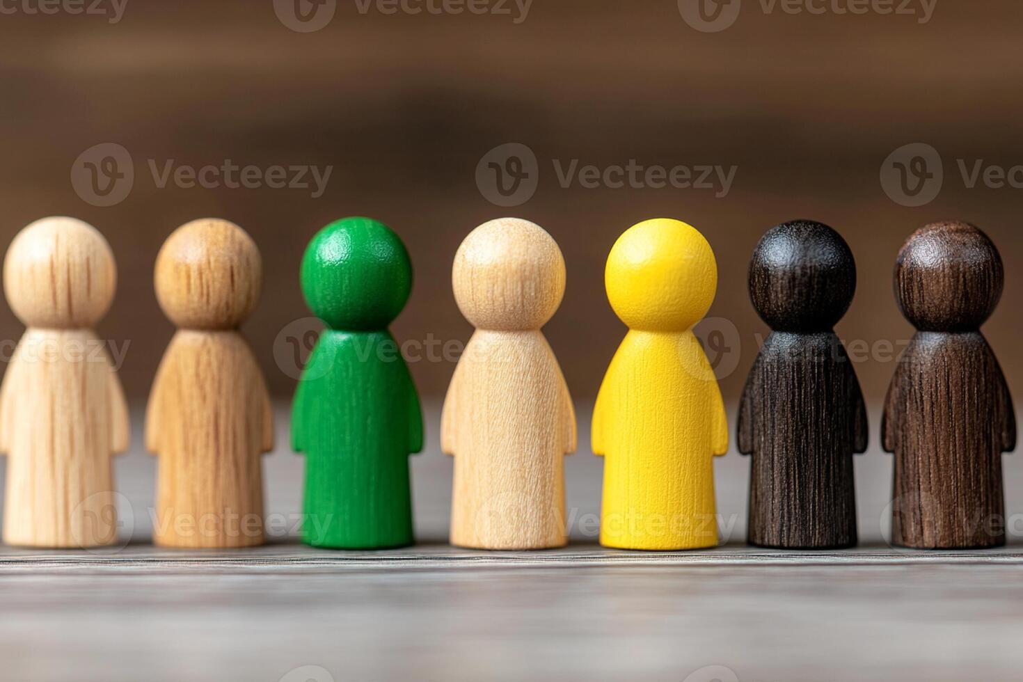 A group of wooden people with different colors photo
