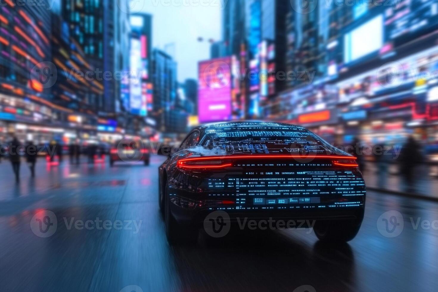 The car is driving down the street at night photo