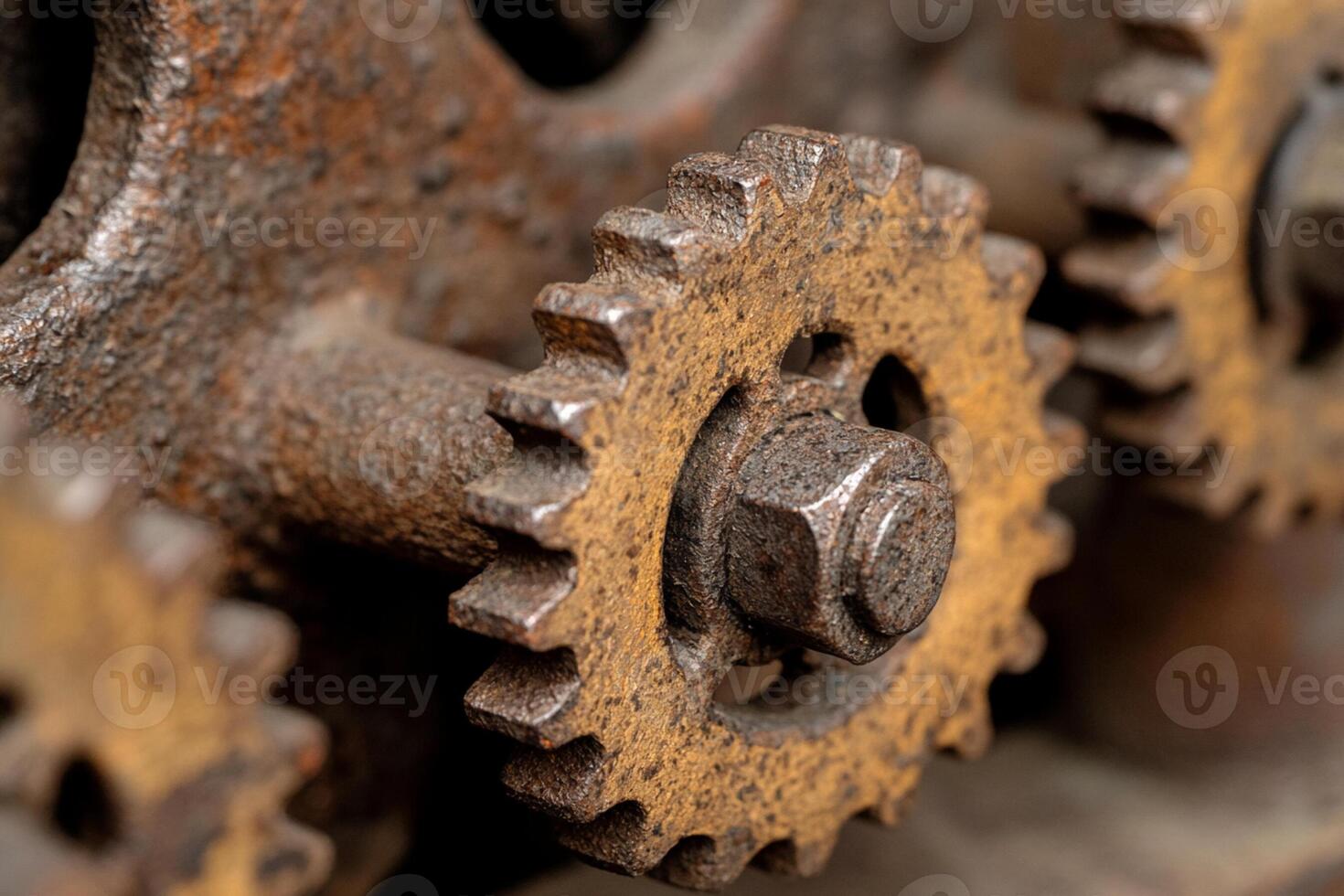 Close up of a rusty metal gear on a machine photo