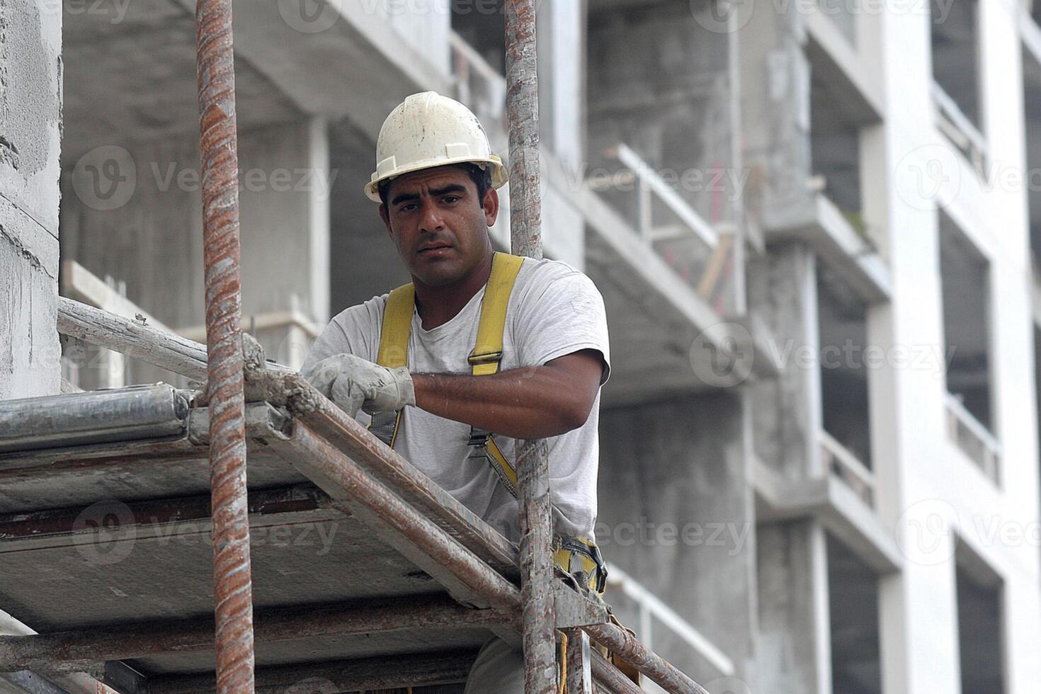 A man on a scaffolding working on a building photo