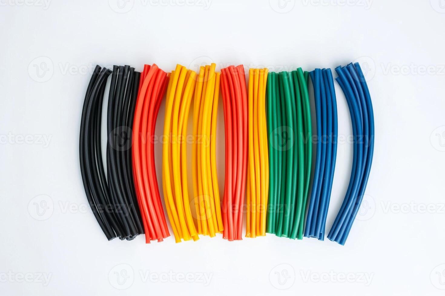 Colorful flexible tubes arranged symmetrically on a white background illustrating creativity and design photo