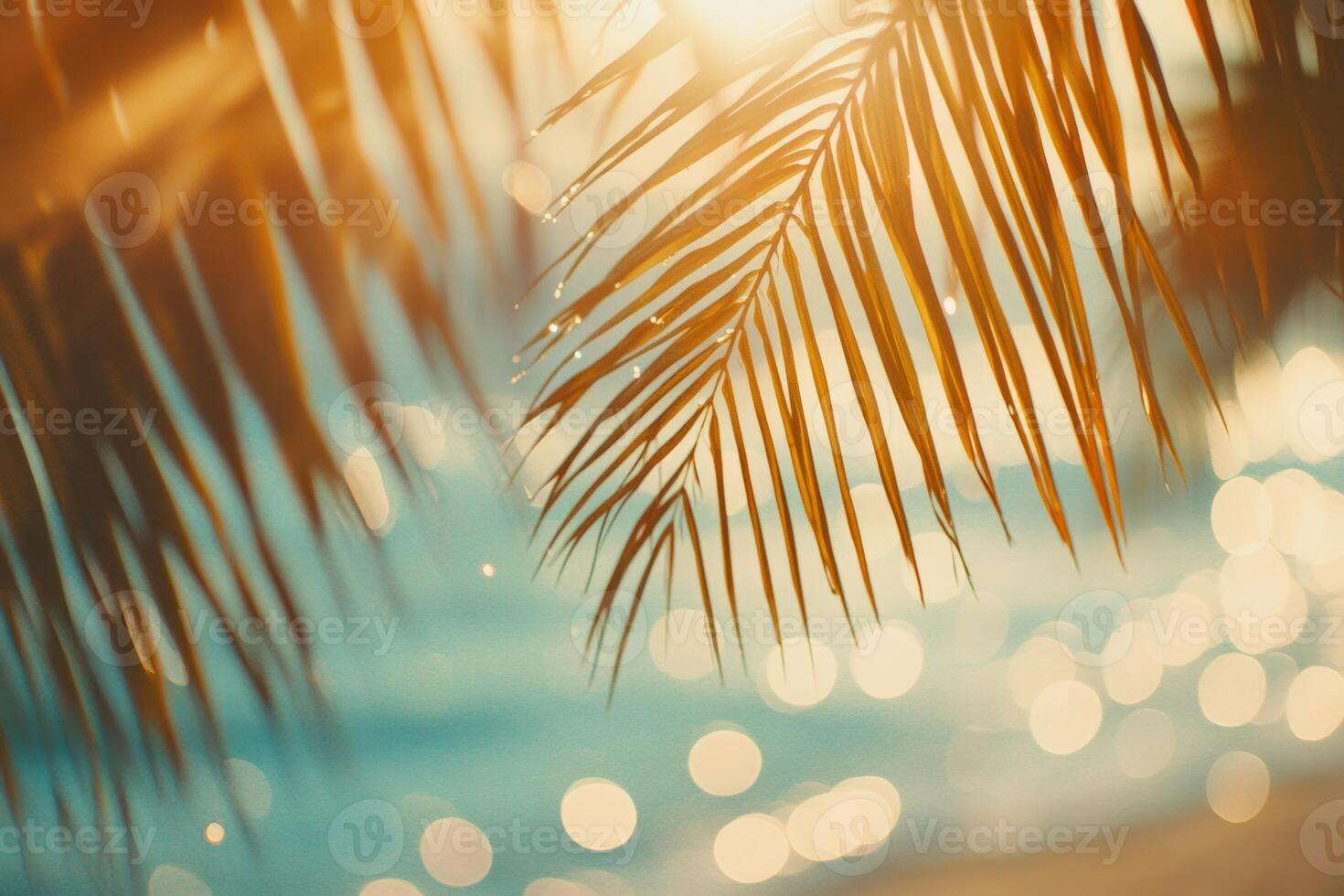 A serene summer day with sunlight filtering through palm leaves, creating a shimmering tropical atmosphere along the blue sea photo