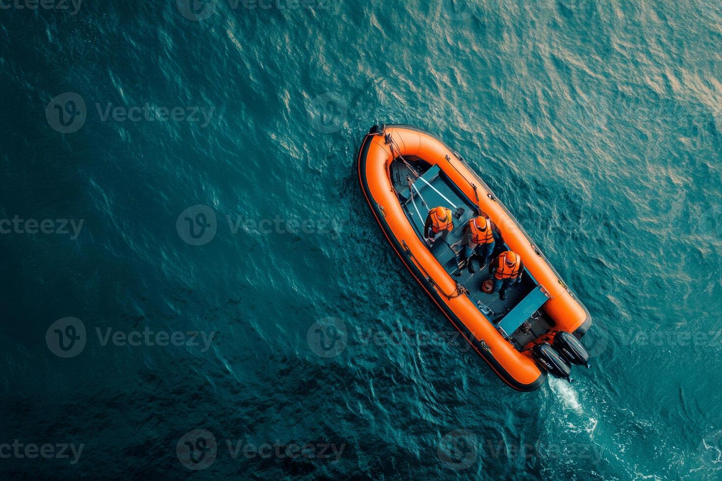 Aerial view of a maintenance platform with workers in safety gear and a boat transporting personnel and tools in offshore waters photo