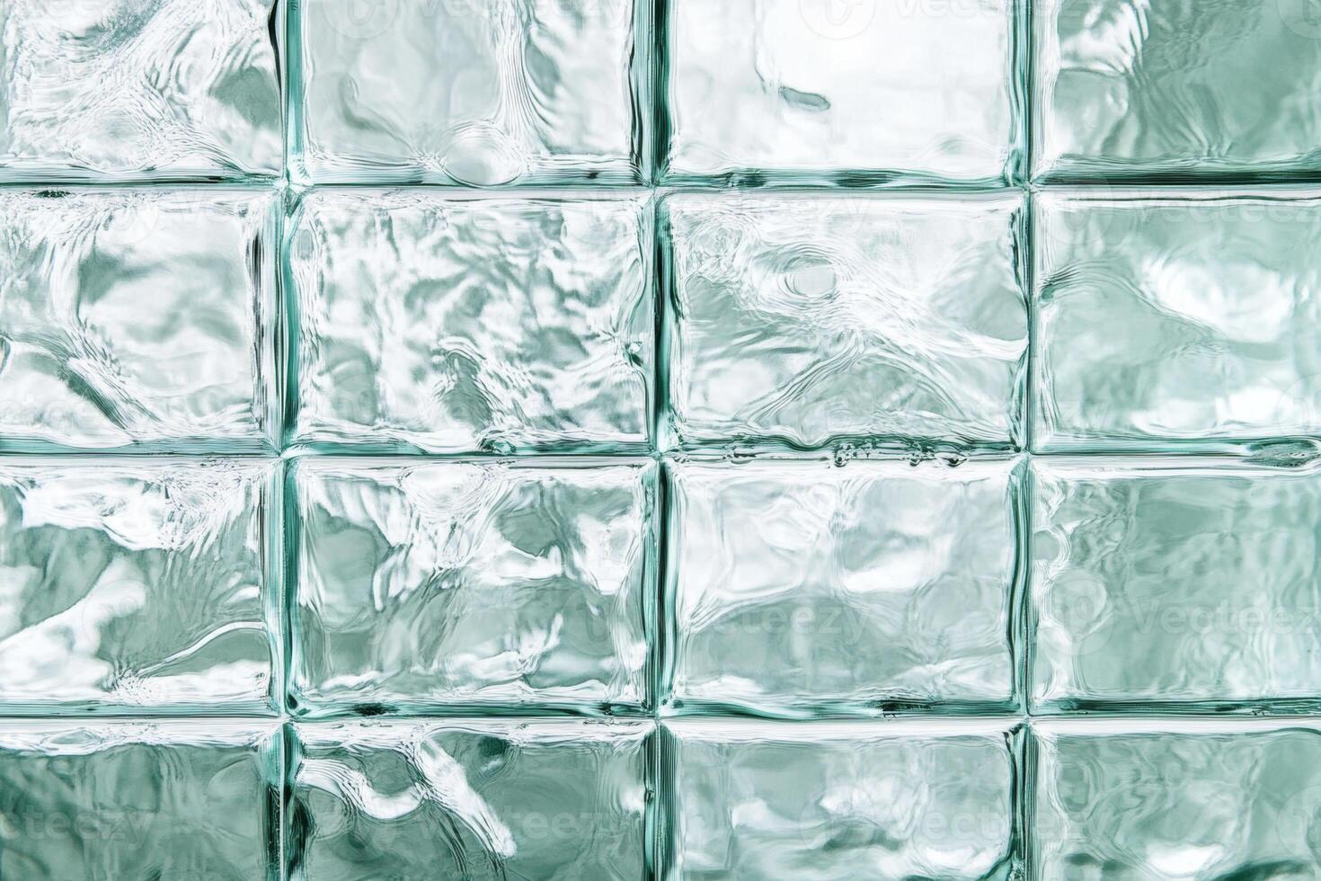 Frosted glass blocks create a textured background showcasing light reflections in a contemporary space photo