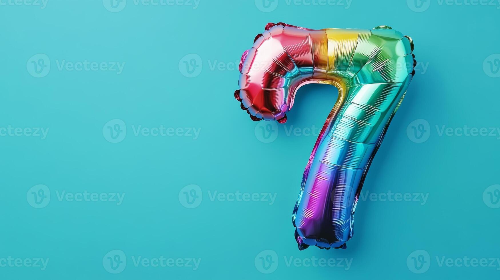 Colorful rainbow foil balloon number twenty-seven against a bright blue background perfect for celebrations or birthday parties photo