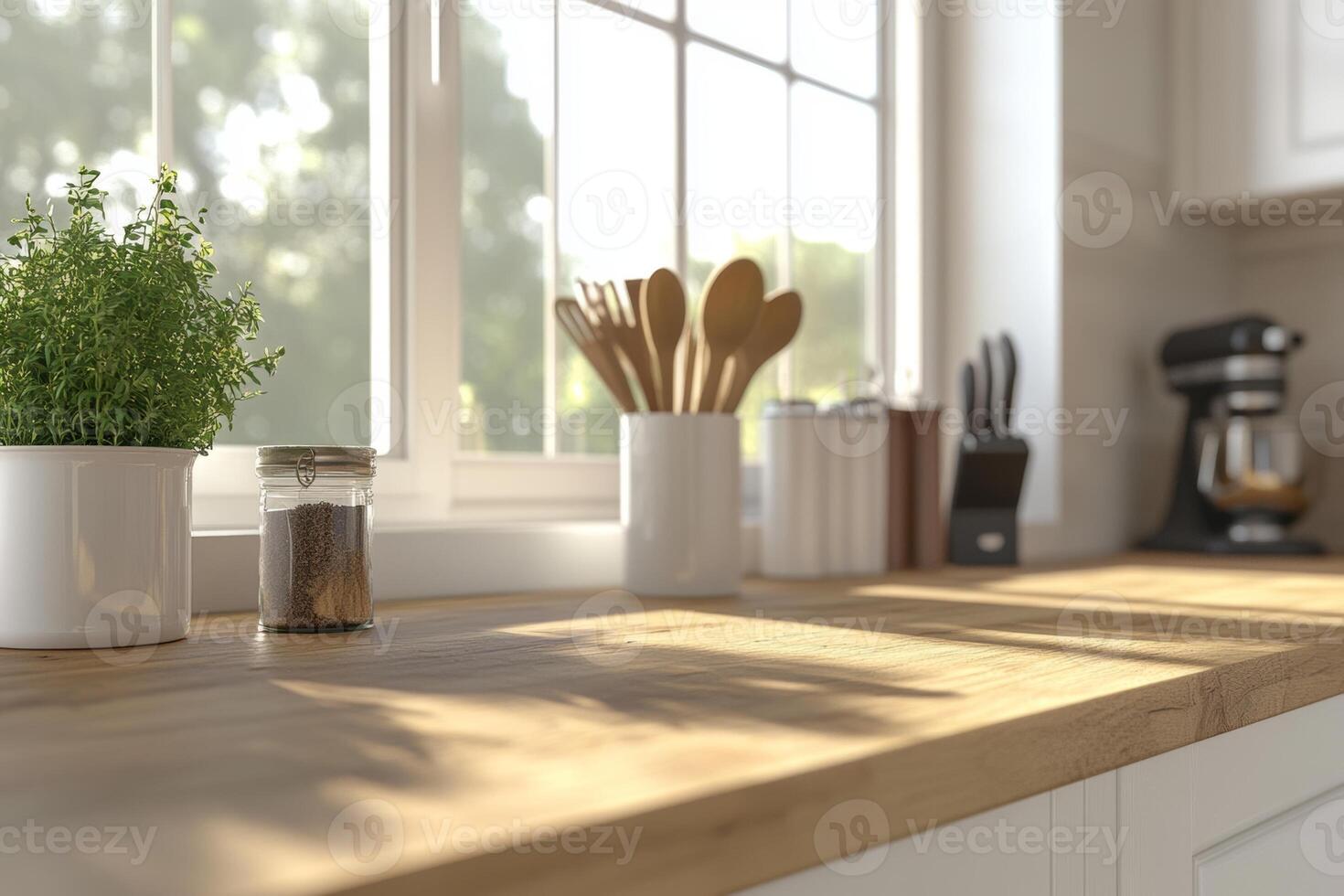 A stylish kitchen with an array of utensils on a wooden countertop near bright windows and white cabinetry in a contemporary setting photo